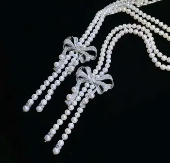 Strani knotting žensk nakit 8-9 mm 120 cm mikro vdelan cirkon bowknot pribor belih sladkovodnih biserna ogrlica